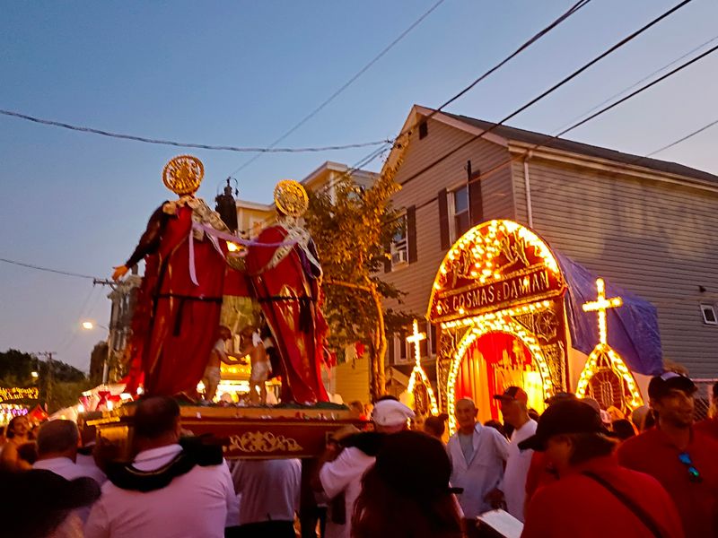 Shoulders, Statues, And A Winding Procession