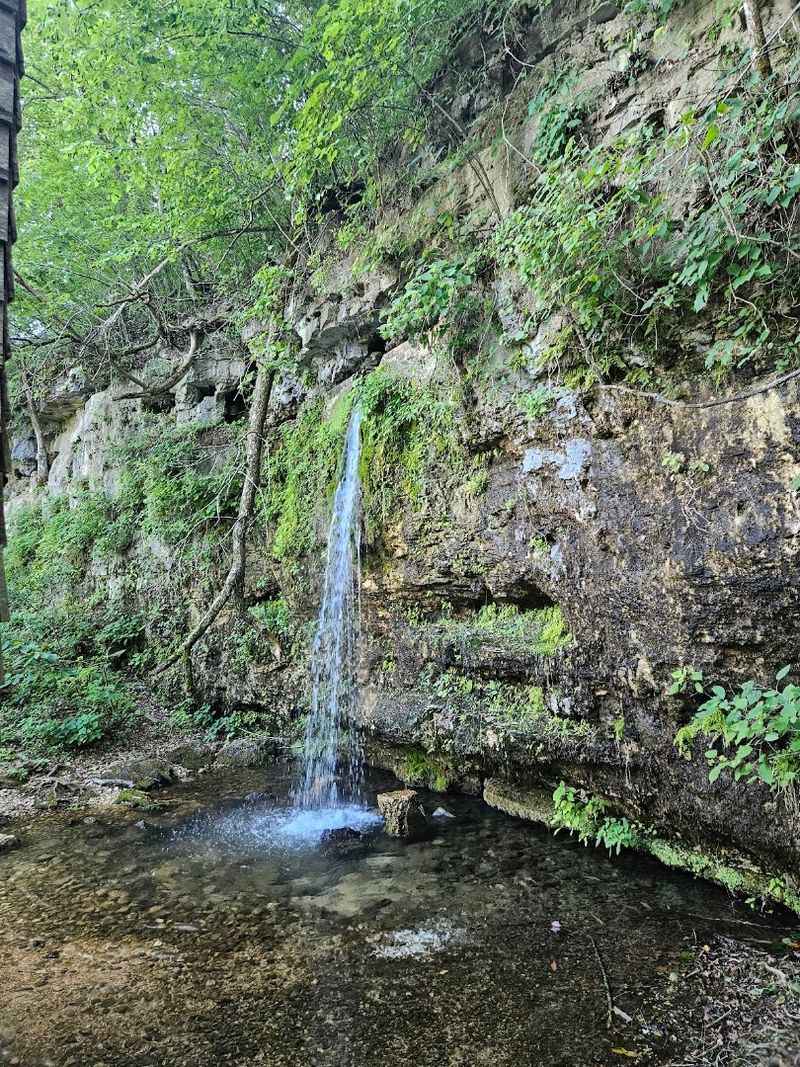 The Waterfall Appears To Pour Straight Out Of The Bluff