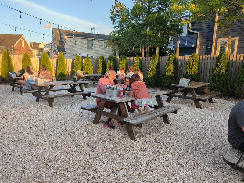 The Pebbled Patio With String Lights