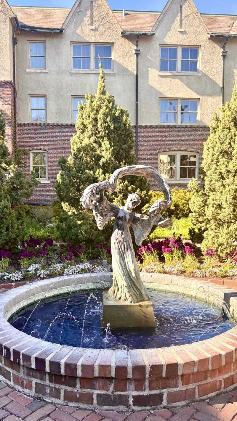 Garden Light, Iron Scrollwork, And A Seat You Will Not Want To Leave