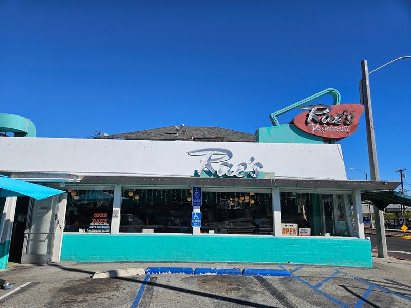 Turquoise Walls And Red Booths Set The Scene