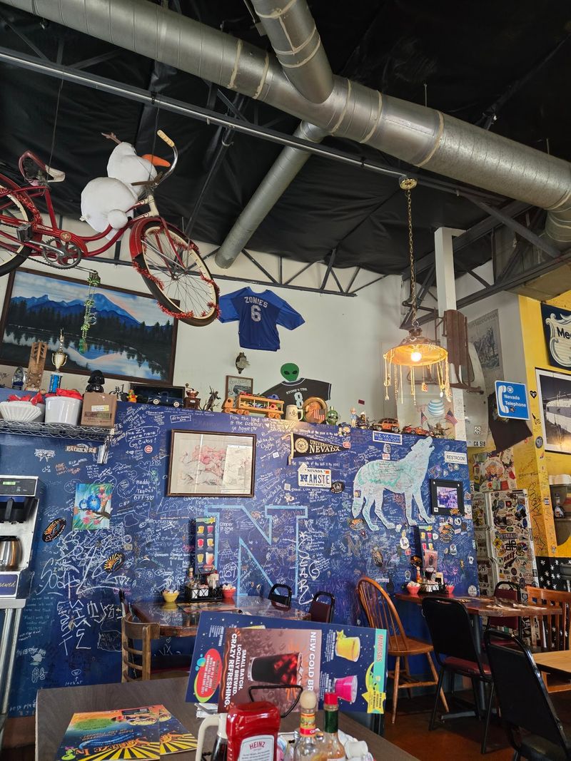 Walls Covered In Signatures, Superheroes, And Firefighter Helmets