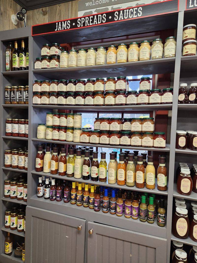 Pantry Shelves Packed With Local Honey, Jams, And Jerky