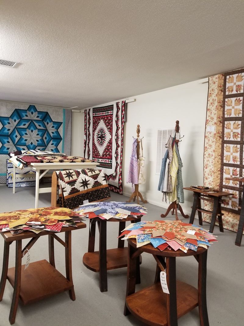 Quilts Spread Out Upstairs Beside Handmade Wooden Toys