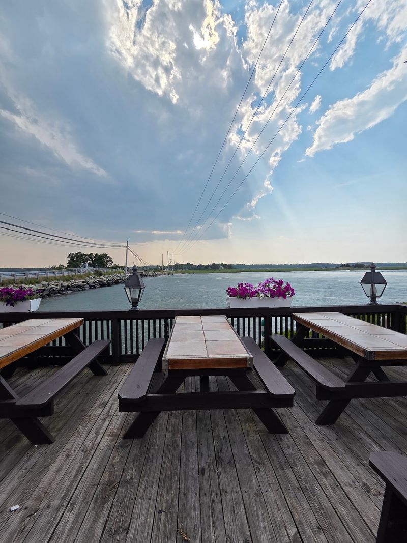 Picnic Tables, A Waterfront Deck, And Sunset Views