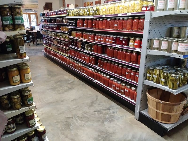 Rows Of Home-Canned Jars Lining The Shelves