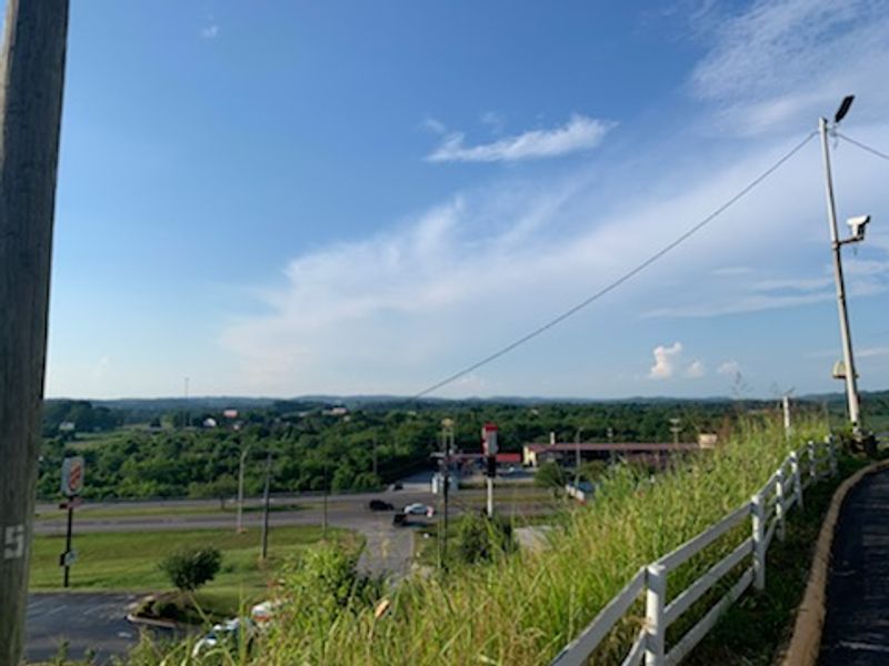 An Interstate Exit With Mountains Behind It