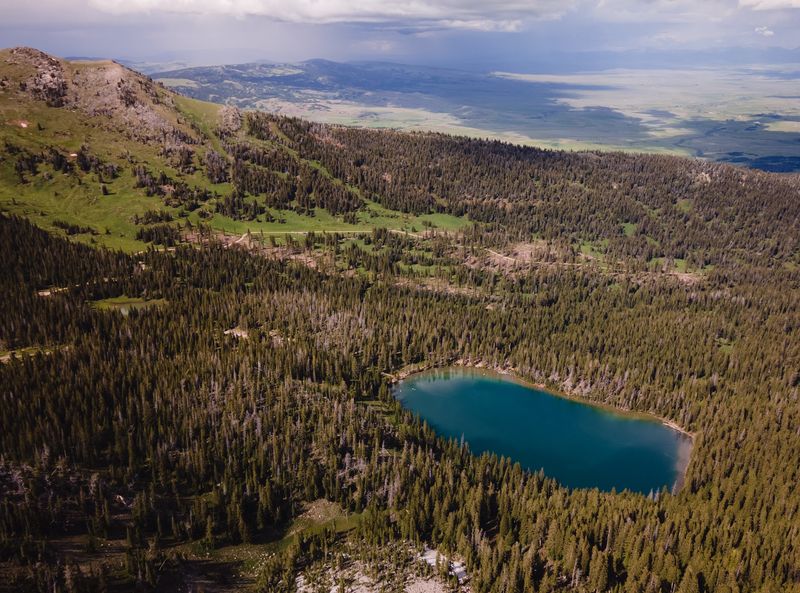 Sacagawea Peak Rises Straight Above The Shoreline