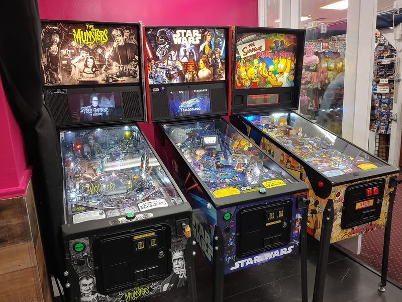 Arcade Games And Pinball Machines By The Tables