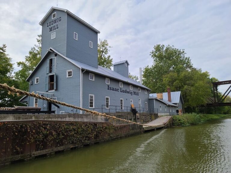 Mules Still Pull A Canal Boat Past A Working Grist Mill In Grand Rapids, Ohio