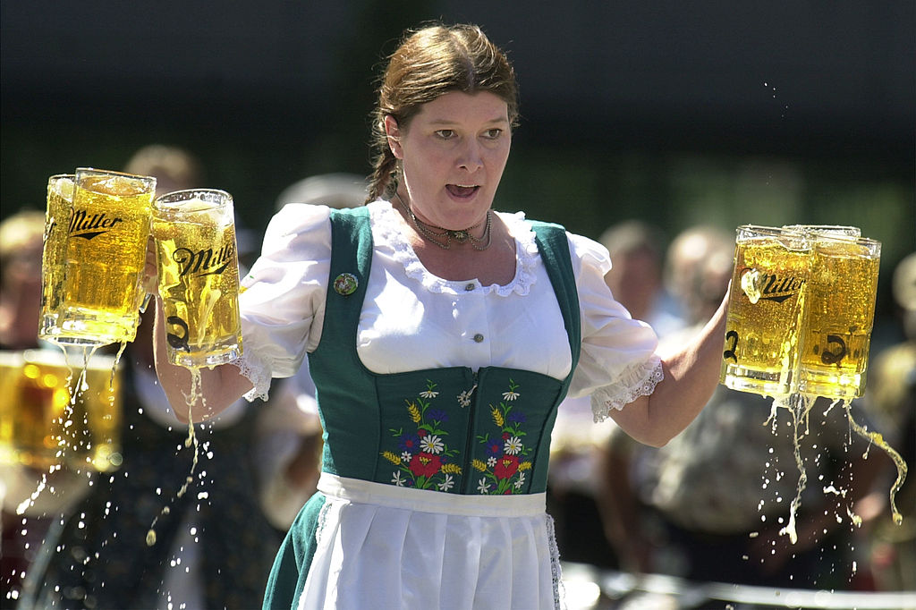 CINCINNATI - SEPTEMBER 17: Annamarie Harten competes in a beer stein race as part of the Gemuetlichkeit Games held as a promotion for Oktoberfest Zinzinnati September 17, 2003 in Cincinnati. Competitors carry 6 beer 1-liter beer steins, which weigh about 30 pounds, a short distance and are penalized for spilled beer. Oktoberfest Zinzinnati is the nation's largest and most authentic Oktoberfest, and will take place September 20 and 21. (Photo by Mike Simons/Getty Images)