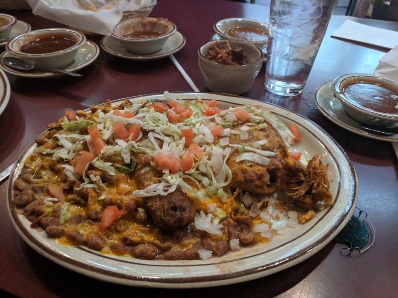 Your Enchiladas Arrive Wearing A Blanket Of Chile