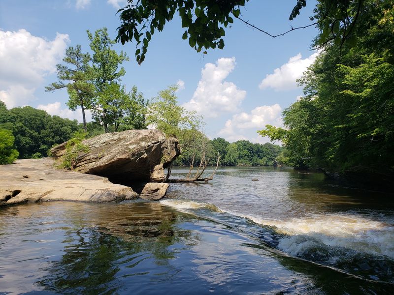Paddlers Can Ride Rapids Along A River Trail