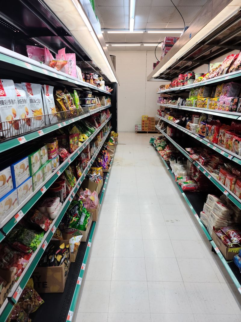 Aisles Of Kimchi, Produce, Cookware, And Candy