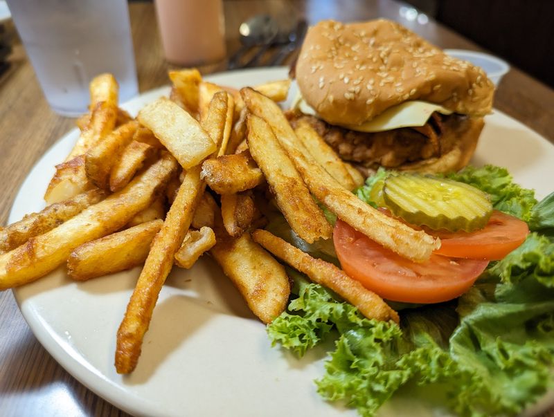 An Onion Ring On Your Burger Is A Bold Move, And It Works