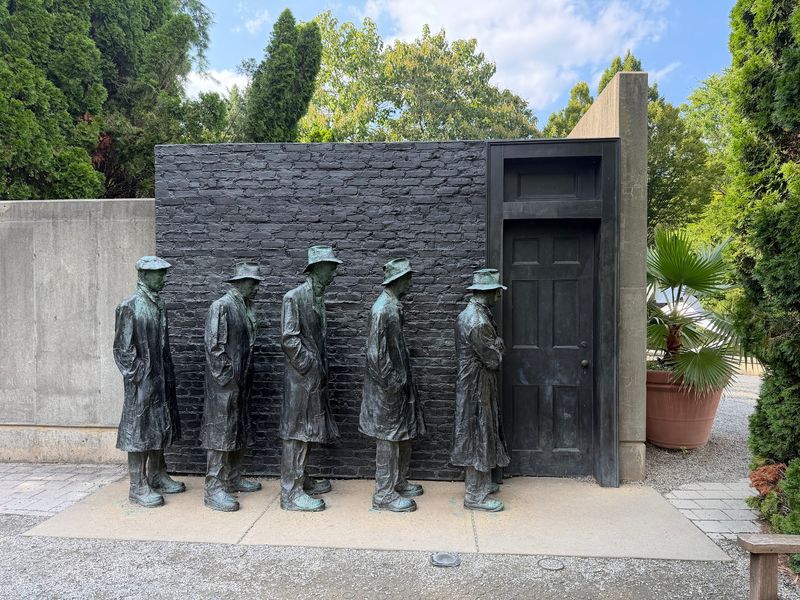 Bronze People Who Almost Say Hello