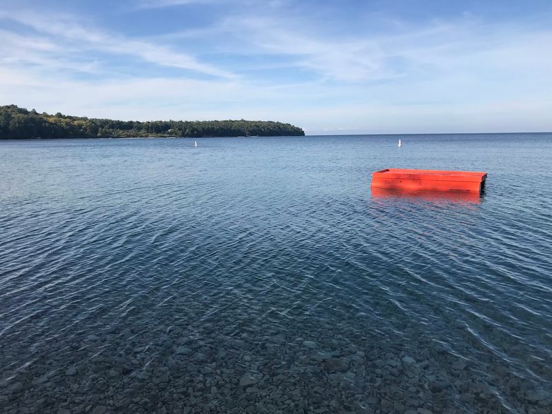 An Orange Raft Is Waiting For Brave Swimmers
