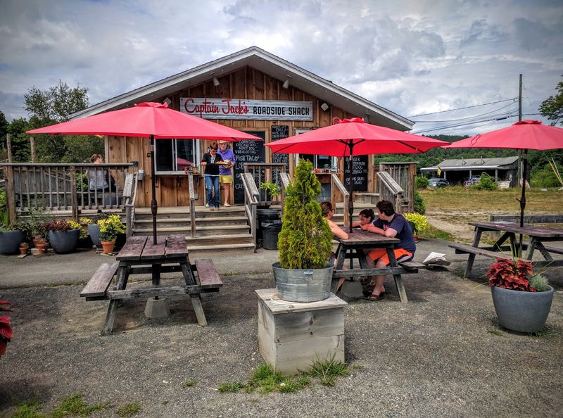 Picnic Tables, String Lights, And A Summer Camp Mood