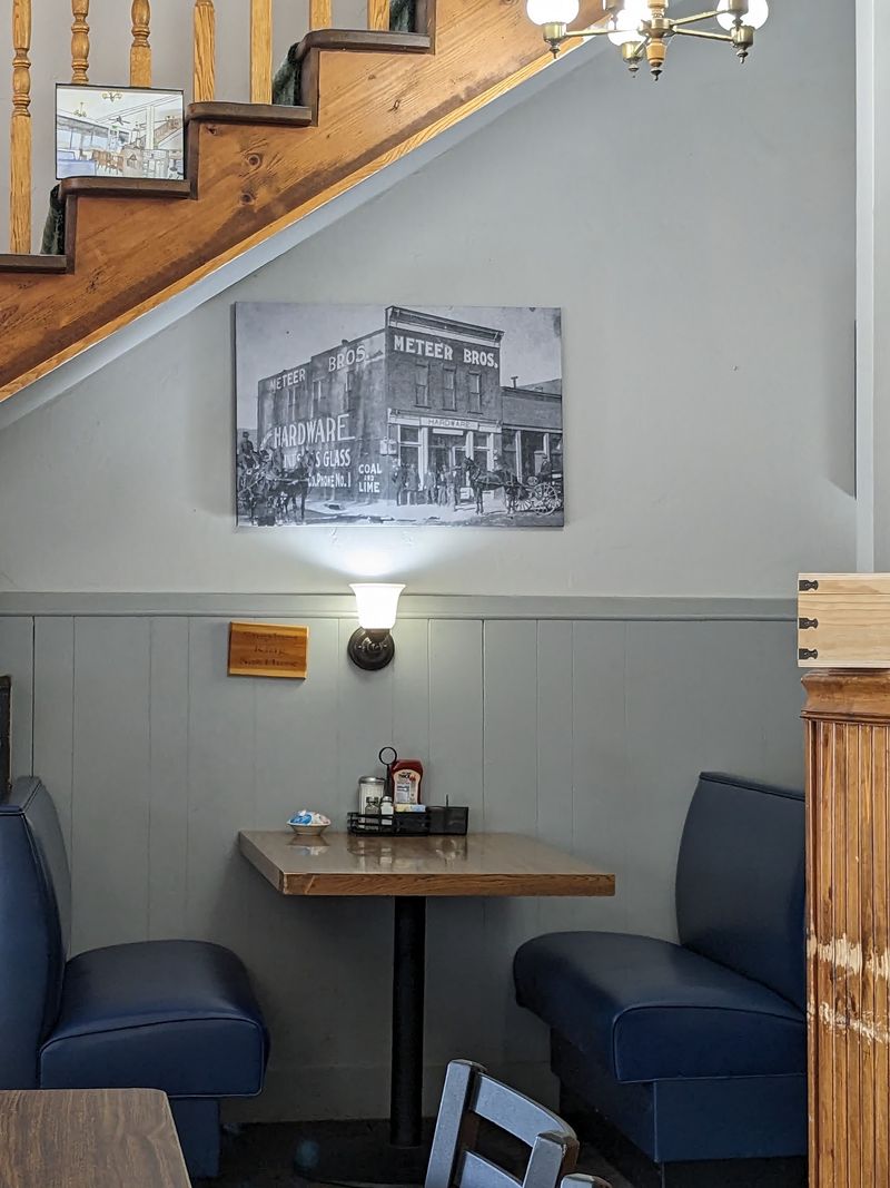 Blue Booths And Old Photos Set The Whole Mood