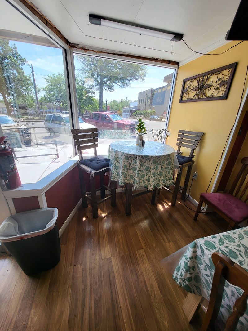 Checkered Tablecloths and Mismatched Tables Set a Homey Mood