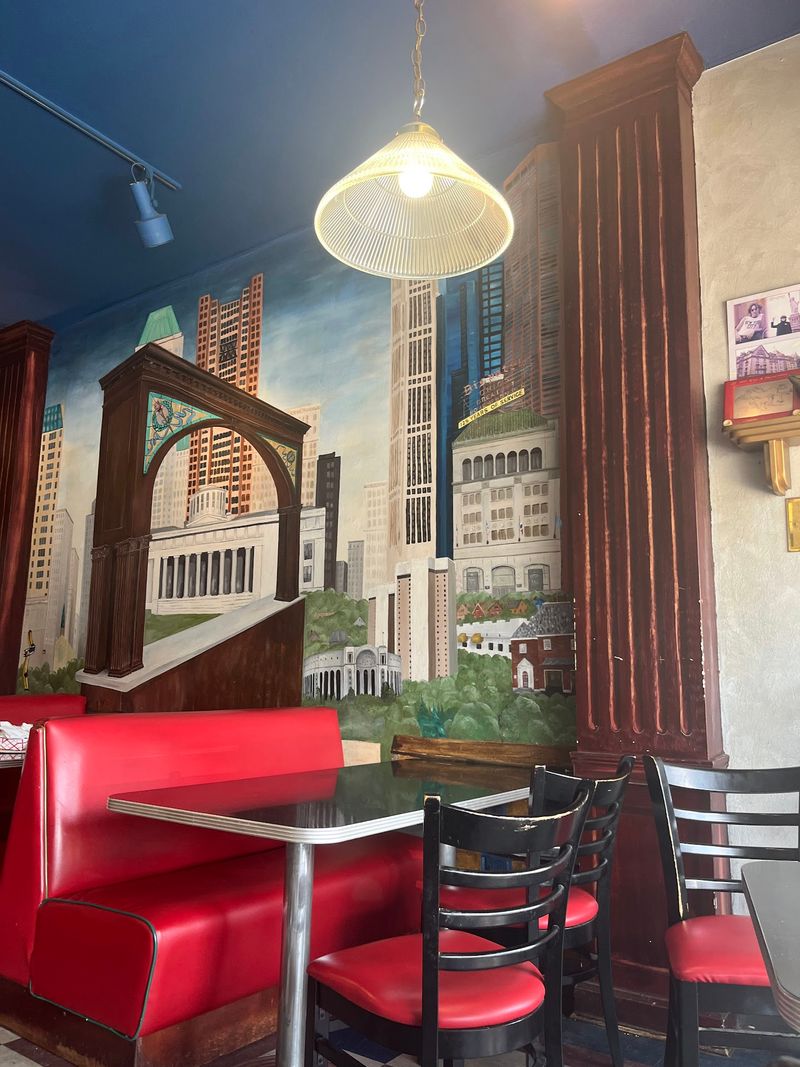 Chrome-Edged Tables And Old Columbus On The Walls