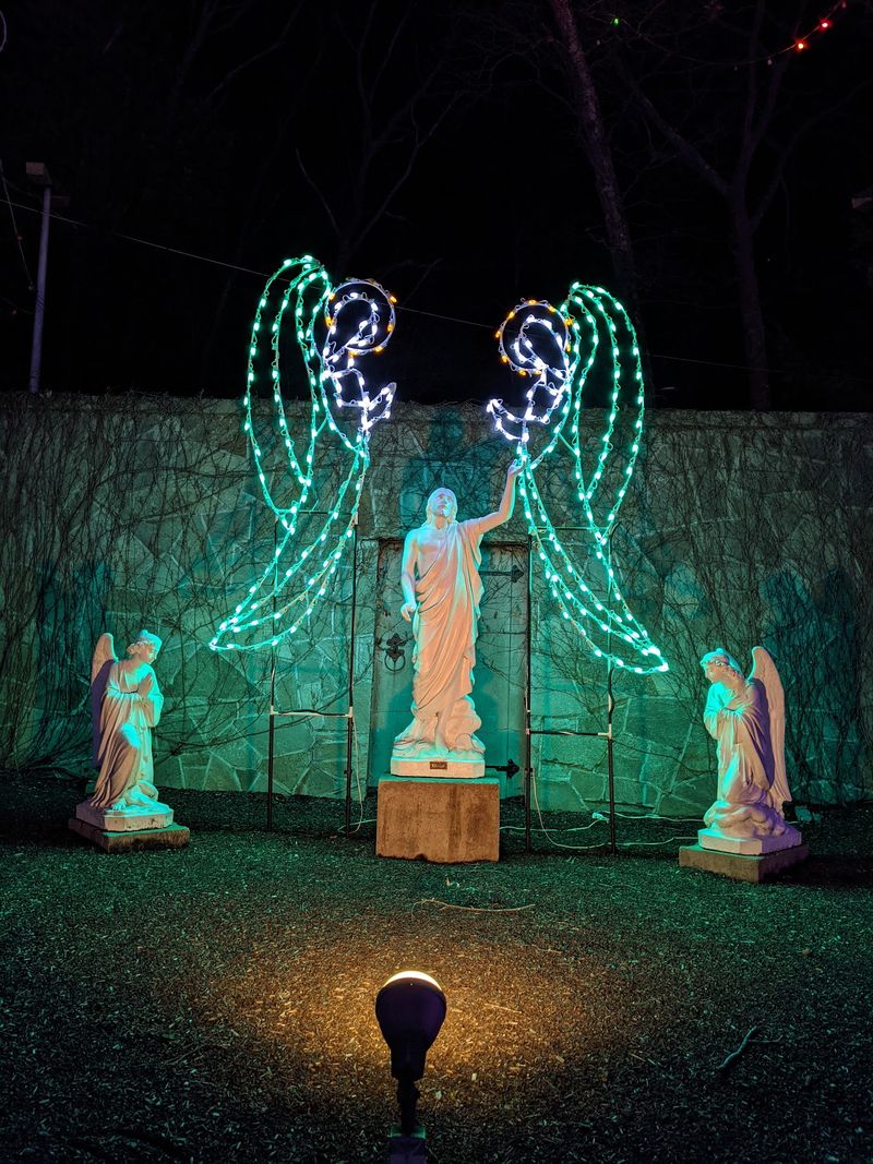 Glowing Paths Lead You To A Giant Rosary And A Peaceful Pond