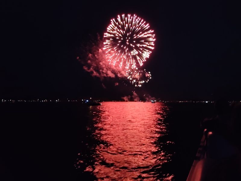 Golden Hour Skies And Fireworks Over The Water