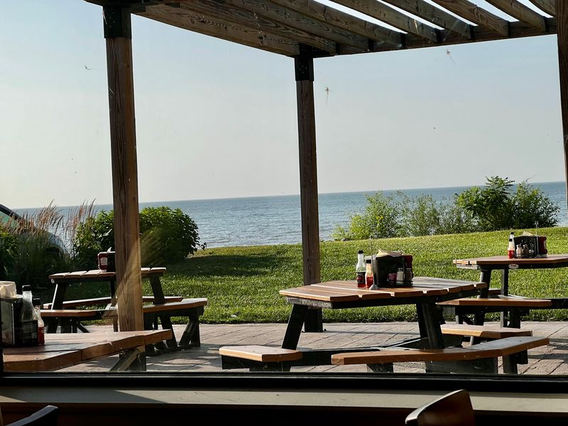 Picnic Tables, Garage Doors, And A Little Beach Out Back