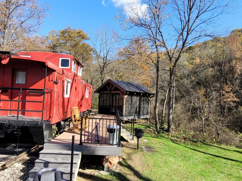 A Bright Red Caboose In The Woods Is Hard To Forget