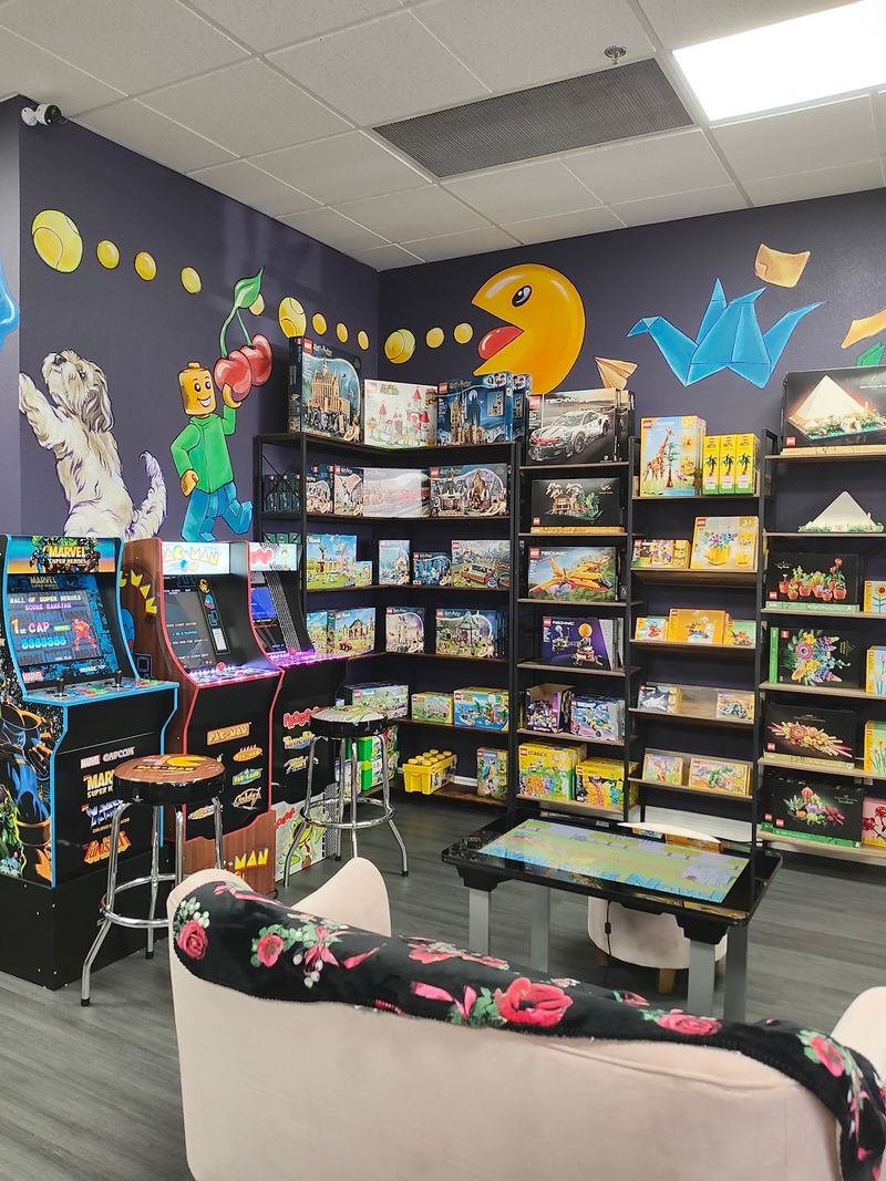A Retro Arcade Corner Waits In The Back