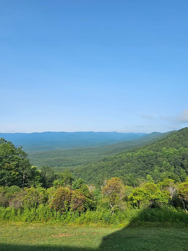 A Mountaintop Lodge With A Window Seat To The Ridges