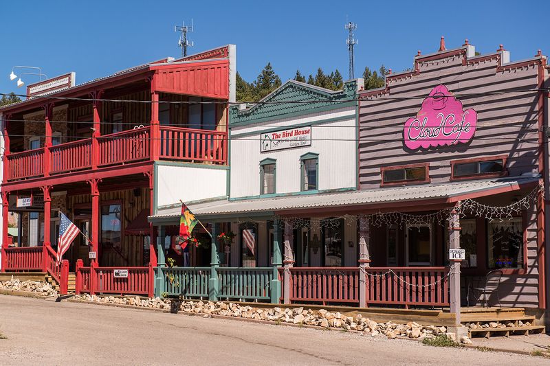 A Wooden Boardwalk Full Of Small Shops
