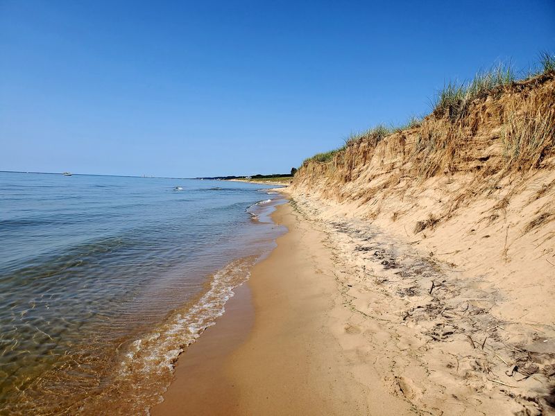 Wild Dunes And Quiet Shoreline Wait Just Outside Town